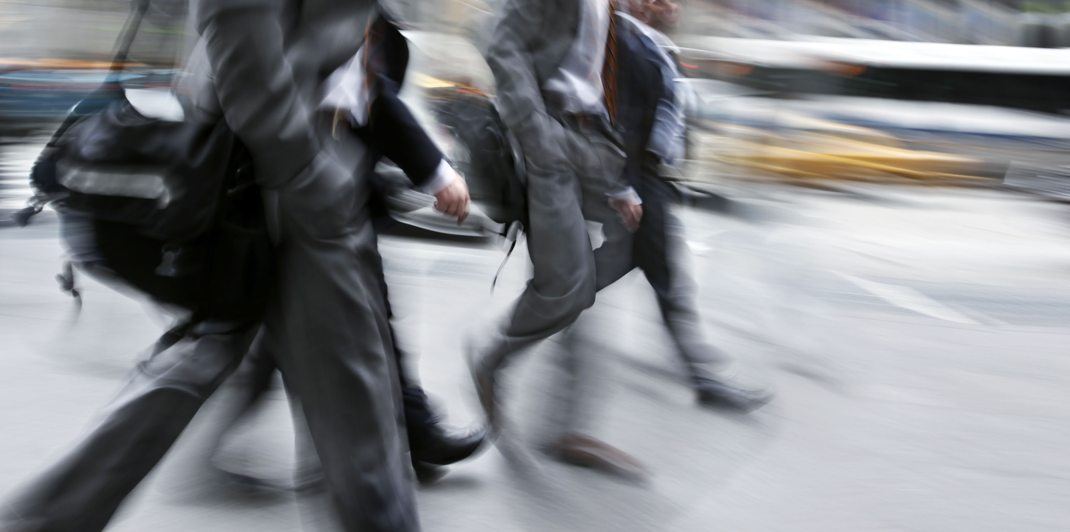 Business people at rush hour walking in the street